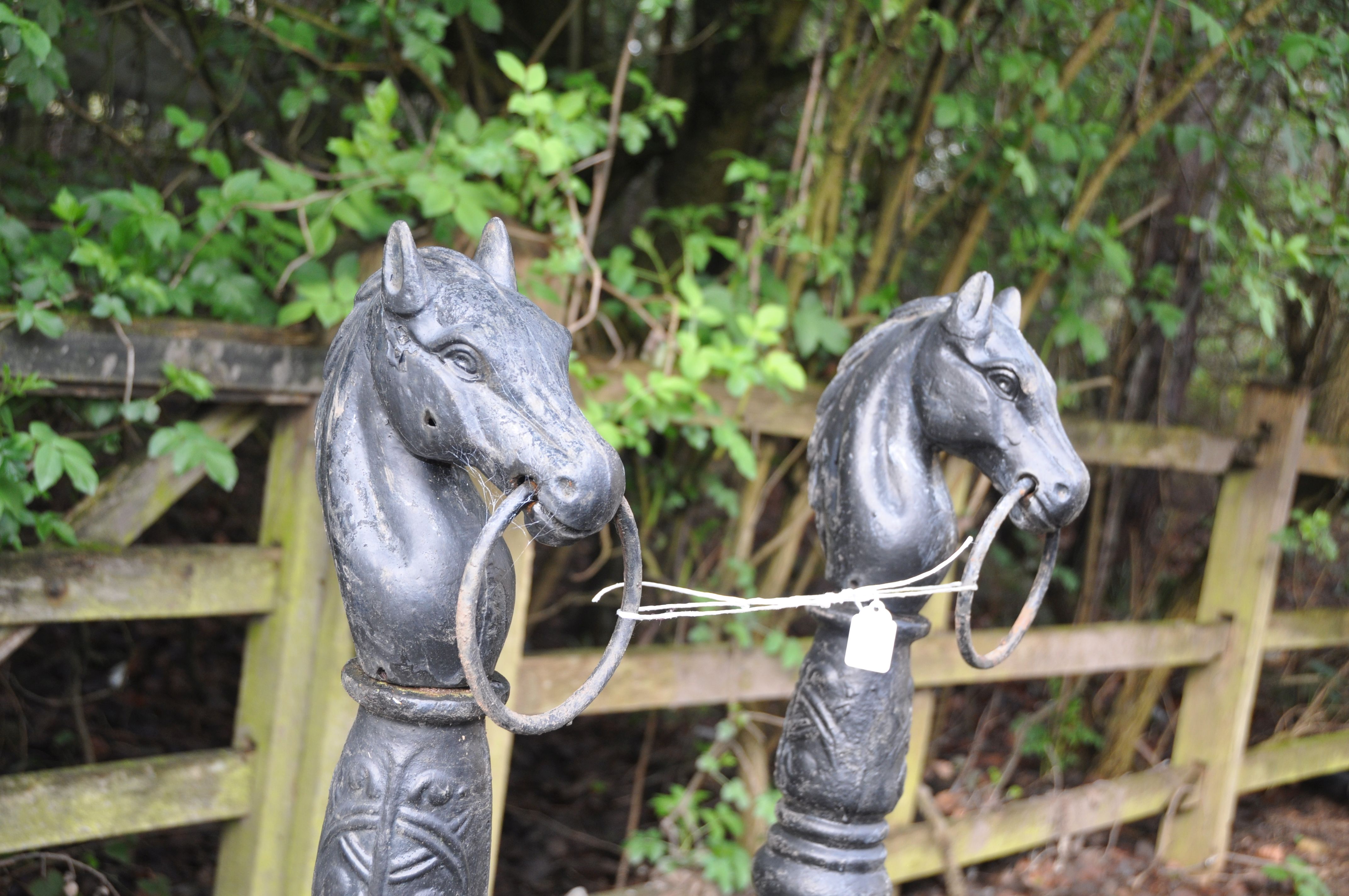 A PAIR OF PAINTED CAST IRON POSTS with what appears to be Celtic detailing, horses heads loose at - Image 2 of 2