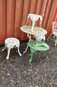 A WEATHERED PAINTED ALUMINIUM GARDEN TABLE with pierced detail 80cm in diameter, three similar