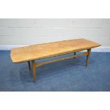 A DANISH MID CENTURY TEAK COFFEE TABLE, with raised edges, raised on tapered legs, united by