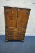 A 20TH CENTURY WALNUT TALLBOY, fitted with double doors, above three drawers, raised on cabriole