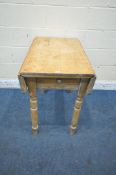 AN EARLY 20TH CENTURY PINE DROP LEAF TABLE, with a single frieze drawer, raised on turned legs, open