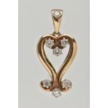 A 9CT GOLD AND DIAMOND PENDANT, designed as an open work heart with scrolling detail, set with seven