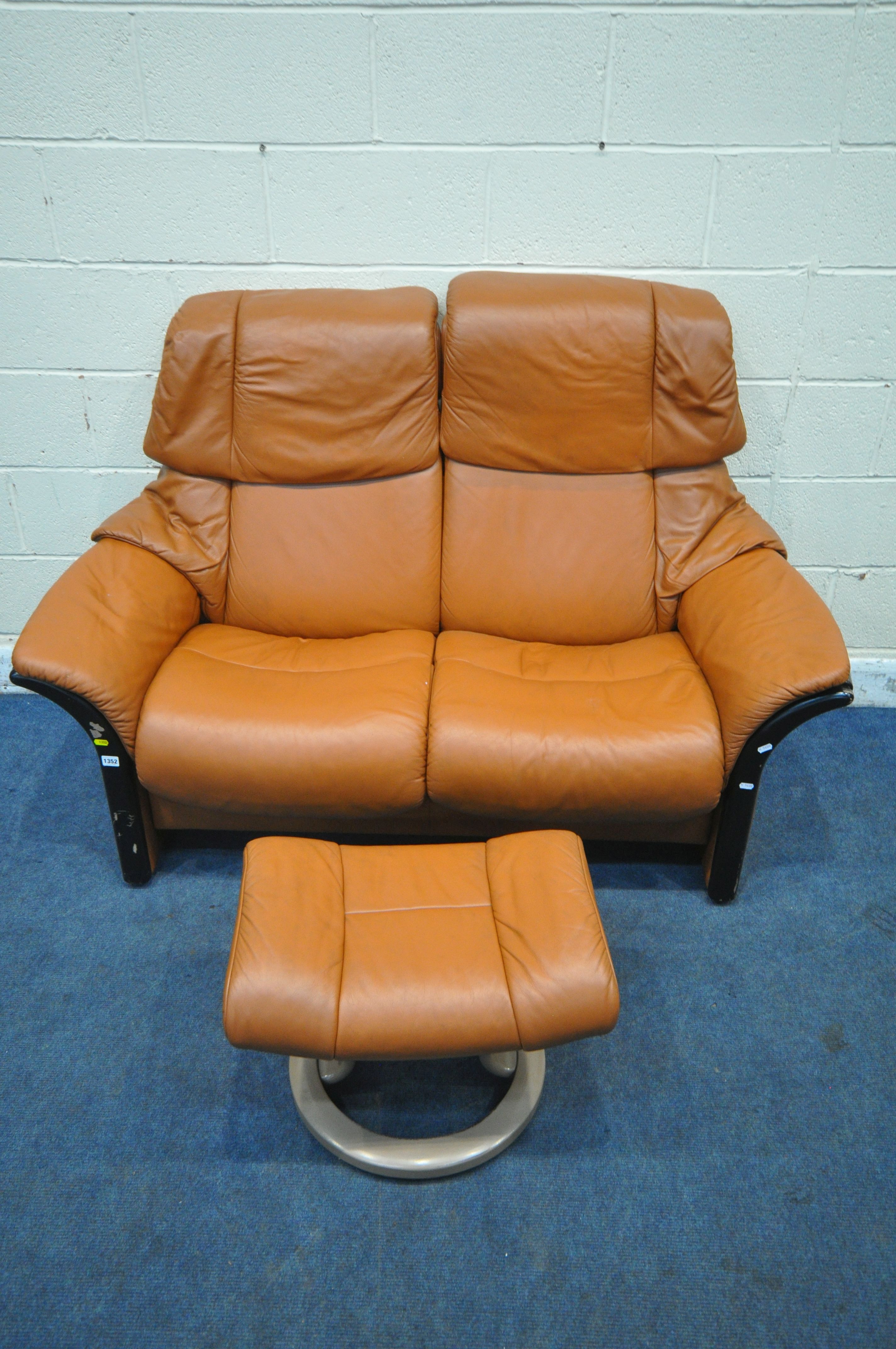 AN EKORNES STRESSLESS TWO SEATER RECLINING SOFA, 154cm x depth 78cm x height 106cm, along with a