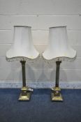 A PAIR OF BRASS CORINTHIAN PILLAR STYLE TABLE LAMPS, with a box plinth and stepped base, with