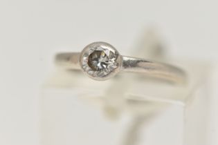 A SINGLE STONE DIAMOND RING, a round brilliant cut diamond bezel set in white metal, approximate