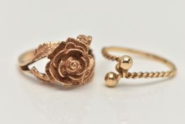 TWO YELLOW METAL RINGS, the first in the form of a textured rose, bifurcated shoulders leading