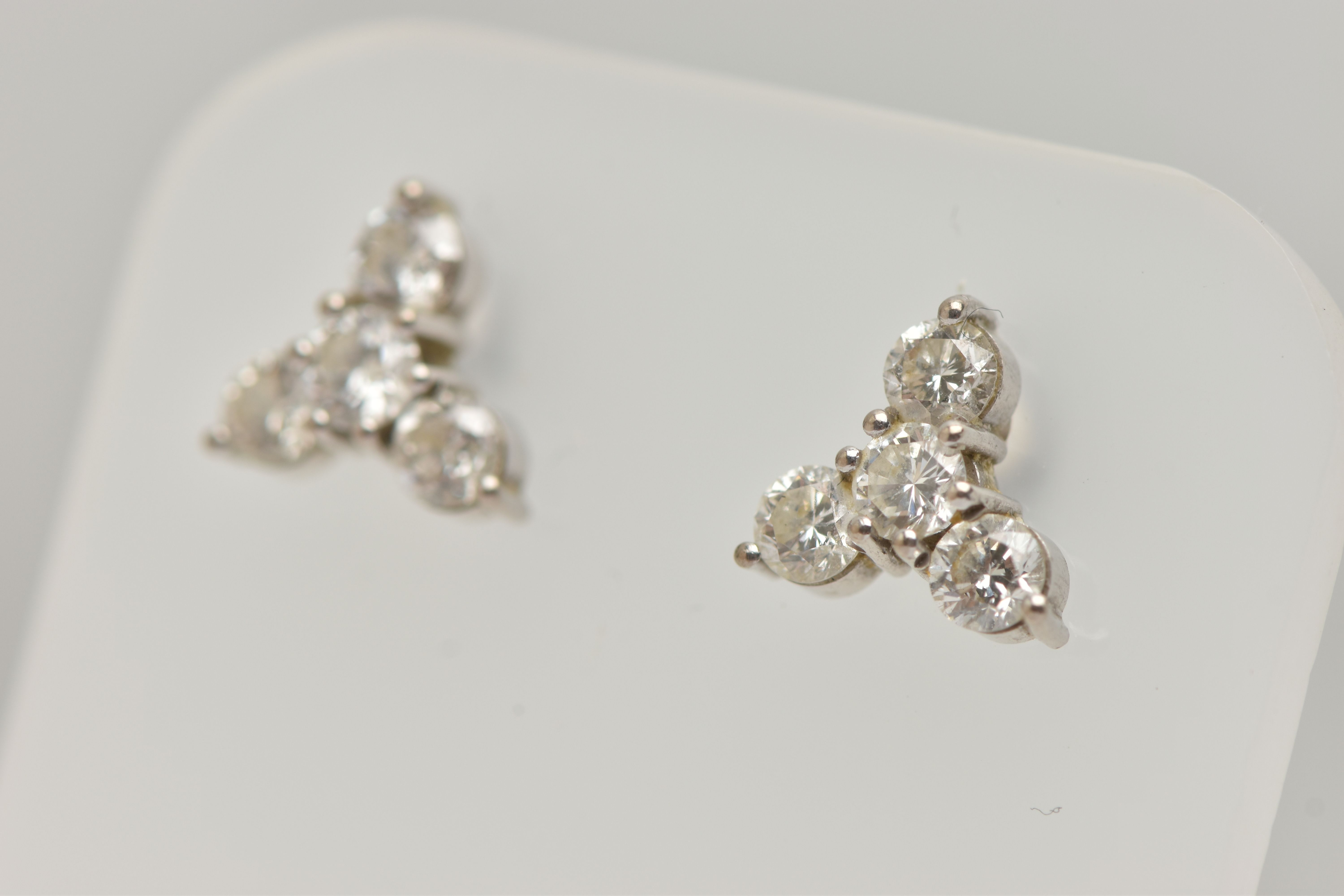 A PAIR OF 18CT GOLD DIAMOND EARRINGS, designed as a trefoil cluster of four round brilliant cut - Image 3 of 4