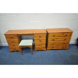 A MODERN PINE DRESSING TABLE, fitted with eight drawers, length 142cm x depth 44cm x height 78cm,