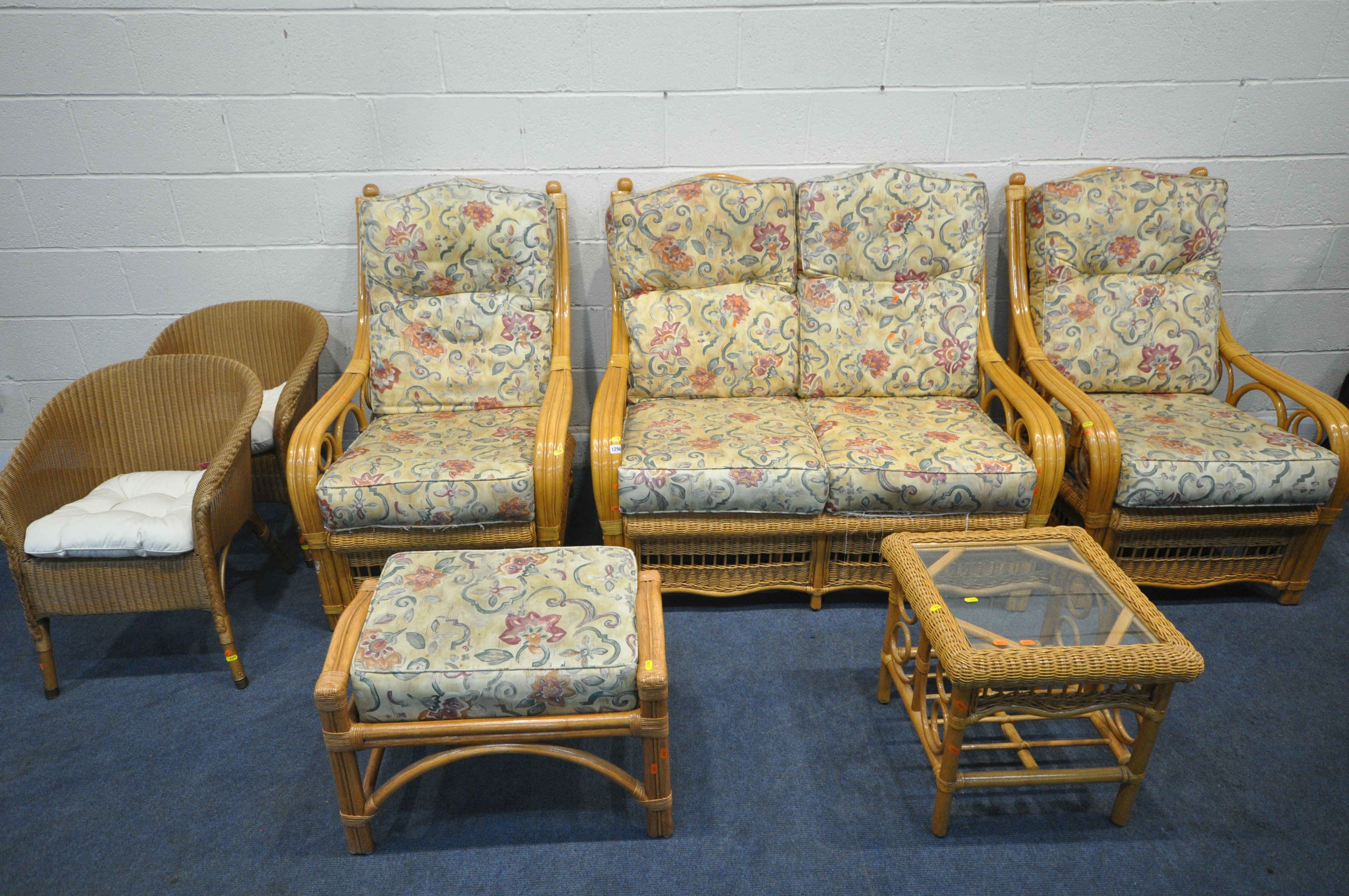 A RATTAN FIVE PIECE CONSERVATORY SUITE, comprising a two seater sofa, a pair of armchairs, a
