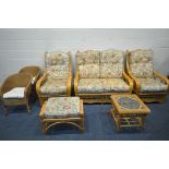 A RATTAN FIVE PIECE CONSERVATORY SUITE, comprising a two seater sofa, a pair of armchairs, a