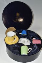 A BOXED ROYAL WORCESTER HARLEQUIN SET OF FOUR COFFEE CUPS AND SAUCERS, bears backstamp 'In