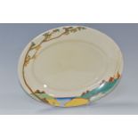 A CLARICE CLIFF OVAL 'SECRETS' PATTERN MEAT PLATE, painted with a stylised tree and cottages in a