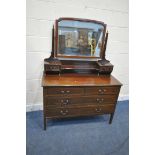 AN EDWARDIAN MAHOGANY AND INLAID DRESSING CHEST, with a single mirror, fitted with seven drawers, on