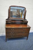 AN EDWARDIAN MAHOGANY AND INLAID DRESSING CHEST, with a single mirror, fitted with seven drawers, on