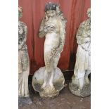 A WEATHERED COMPOSITE GARDEN FIGURE OF A CLAD LADY STANDING IN A SHELL, height 119cm (Condition