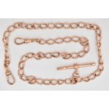 A 9CT ROSE GOLD DOUBLE ALBERT CHAIN, curb links each stamped 9.375, fitted with a T-bar,