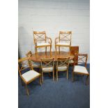 A 20TH CENTURY YEW WOOD TEN PIECE SUITE, comprising an oval twin pedestal dining table, with one