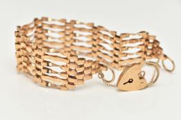 A 9CT GOLD GATE BRACELET, six bar bracelet, approximate width 19.5mm, fitted with a heart padlock