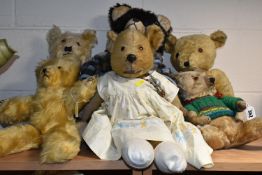 SIX VINTAGE TEDDY BEARS, comprising a much loved straw filled jointed bear, glass eyes. stitched