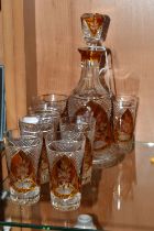 A CONTINENTAL AMBER CUT TO CLEAR DECANTER AND GLASSES, the part set incudes mallet form decanter