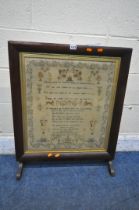 A VICTORIAN ROSEWOOD TAPESTRY FIRE SCREEN, with a needlework mourning tapestry, width 64cm x 79cm (