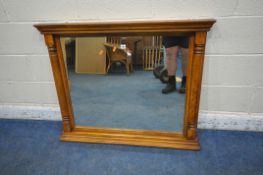 A GOOD QUALITY SOLID OAK OVERMANTEL MIRROR, with pillar style details, 104cm x 85cm (condition