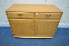 AN ERCOL WINDSOR ELM AND BEECH CABINET, fitted with two drawers, above two cupboard doors, width