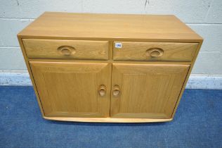 AN ERCOL WINDSOR ELM AND BEECH CABINET, fitted with two drawers, above two cupboard doors, width