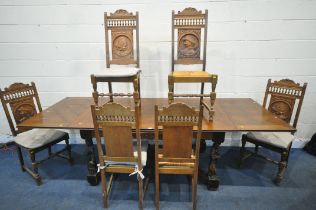 A 20TH CENTURY FRENCH OAK DRAW LEAF BRETON TABLE, raised on four carved standing figures, open