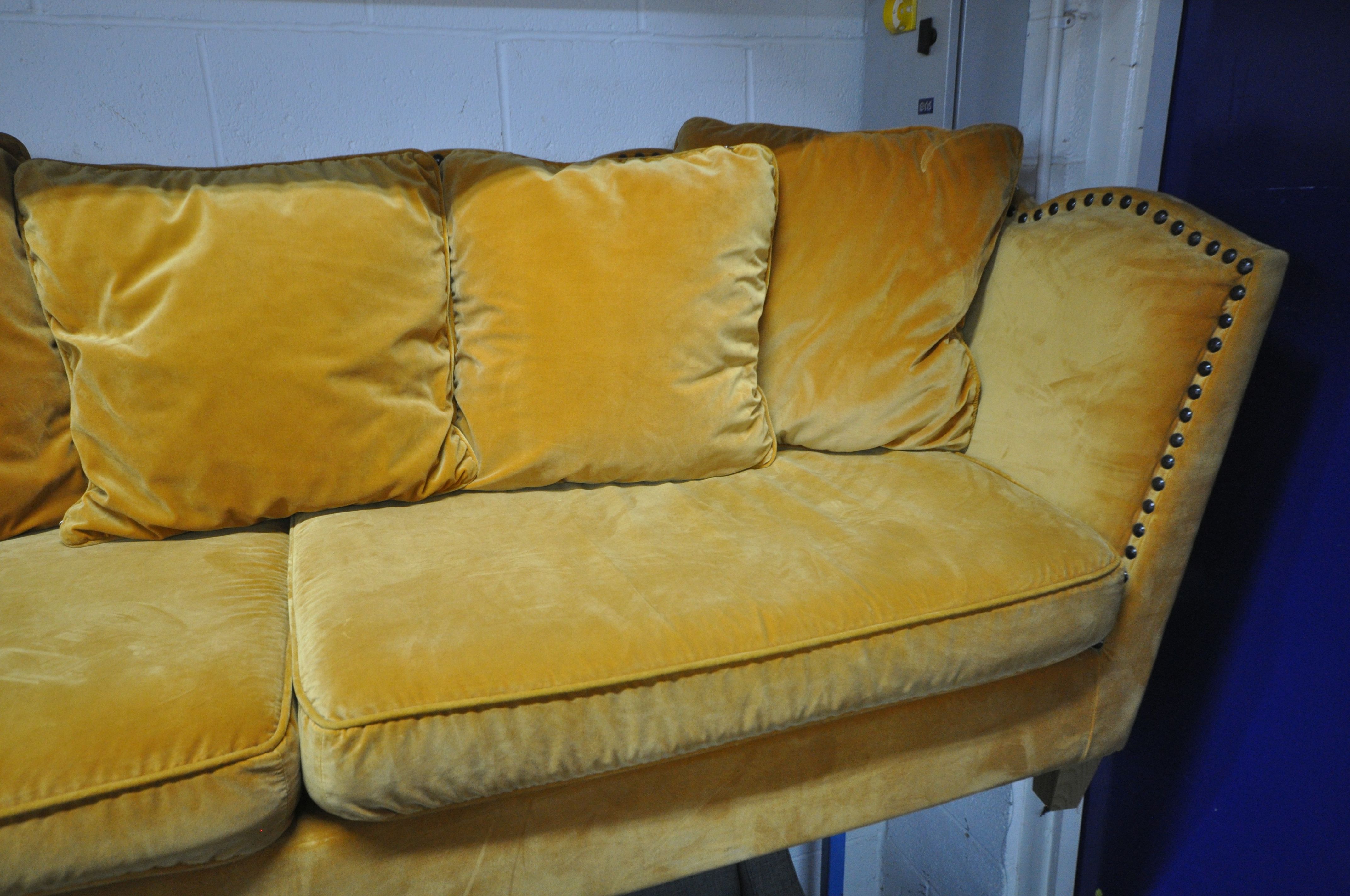 A GOLD VELOUR UPHOLSTERED SOFA, with a studded back, sides, and a shaped top, on square light oak - Image 2 of 8