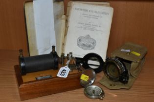 A 1942 MILITARY COMPASS, G.E.C No. 140227 with canvas case (mechanism damaged), an 1892 edition of