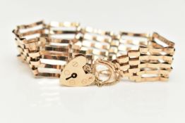 A 9CT GOLD GATE BRACELET, five bar bracelet, approximate width 15.8mm, fitted with a heart padlock