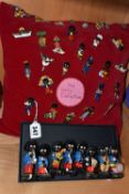 A COLLECTION OF ROBERTSONS JAM FIGURES AND BADGES, comprising eight chalkware jazz band musician