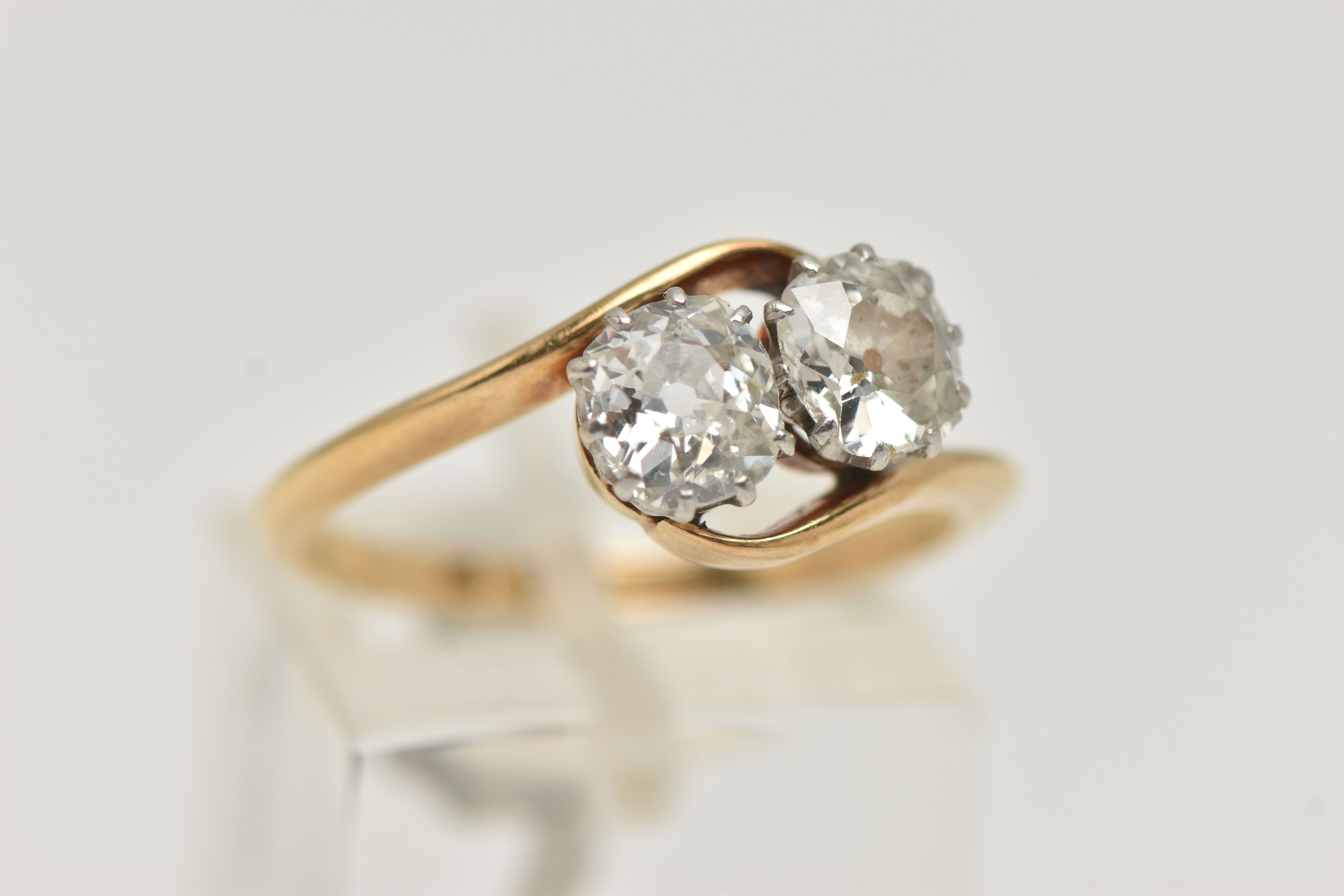 A YELLOW METAL DIAMOND TWO STONE RING, two old cut diamonds, each in a ten claw white metal setting, - Image 4 of 4