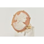 A YELLOW METAL CAMEO RING, the oval cameo in a six claw setting, depicting a lady in profile, to the
