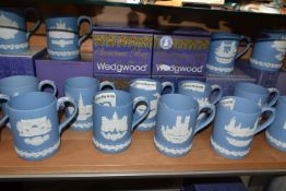FIFTEEN WEDGWOOD JASPERWARE CHRISTMAS MUGS, in pale blue, decorated with Royal Palaces and London