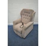 AN UNBRANDED RISE AND RECLINE ARMCHAIR (condition report: in need of a clean, stained,