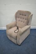 AN UNBRANDED RISE AND RECLINE ARMCHAIR (condition report: in need of a clean, stained,