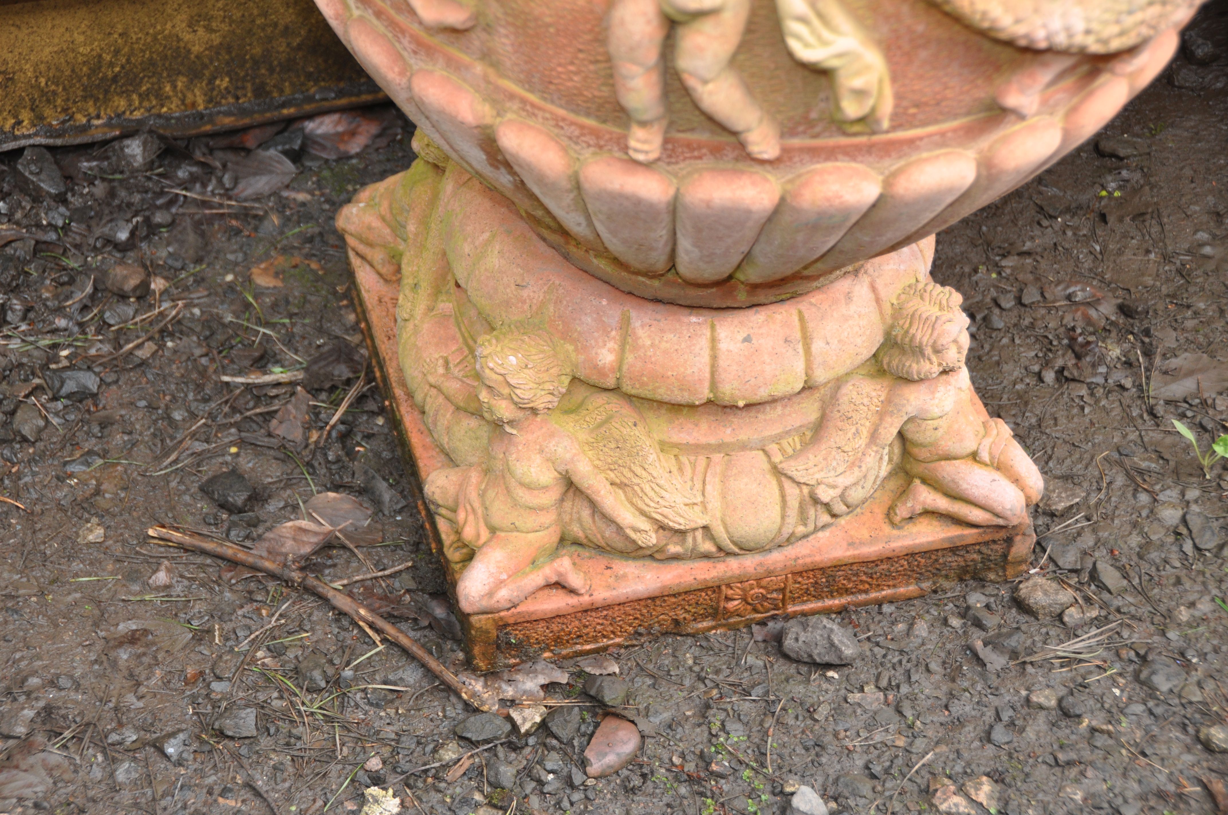 A PAIR OF LARGE MODERN COMPOSITE GARDEN URNS, terracotta painted, with Cherubs holding garlands of - Image 4 of 5