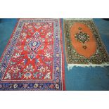 A WOOLLEN RED GROUND IRANIAN RECTANGULAR RUG, with central medallion, foliate design and multi-strap