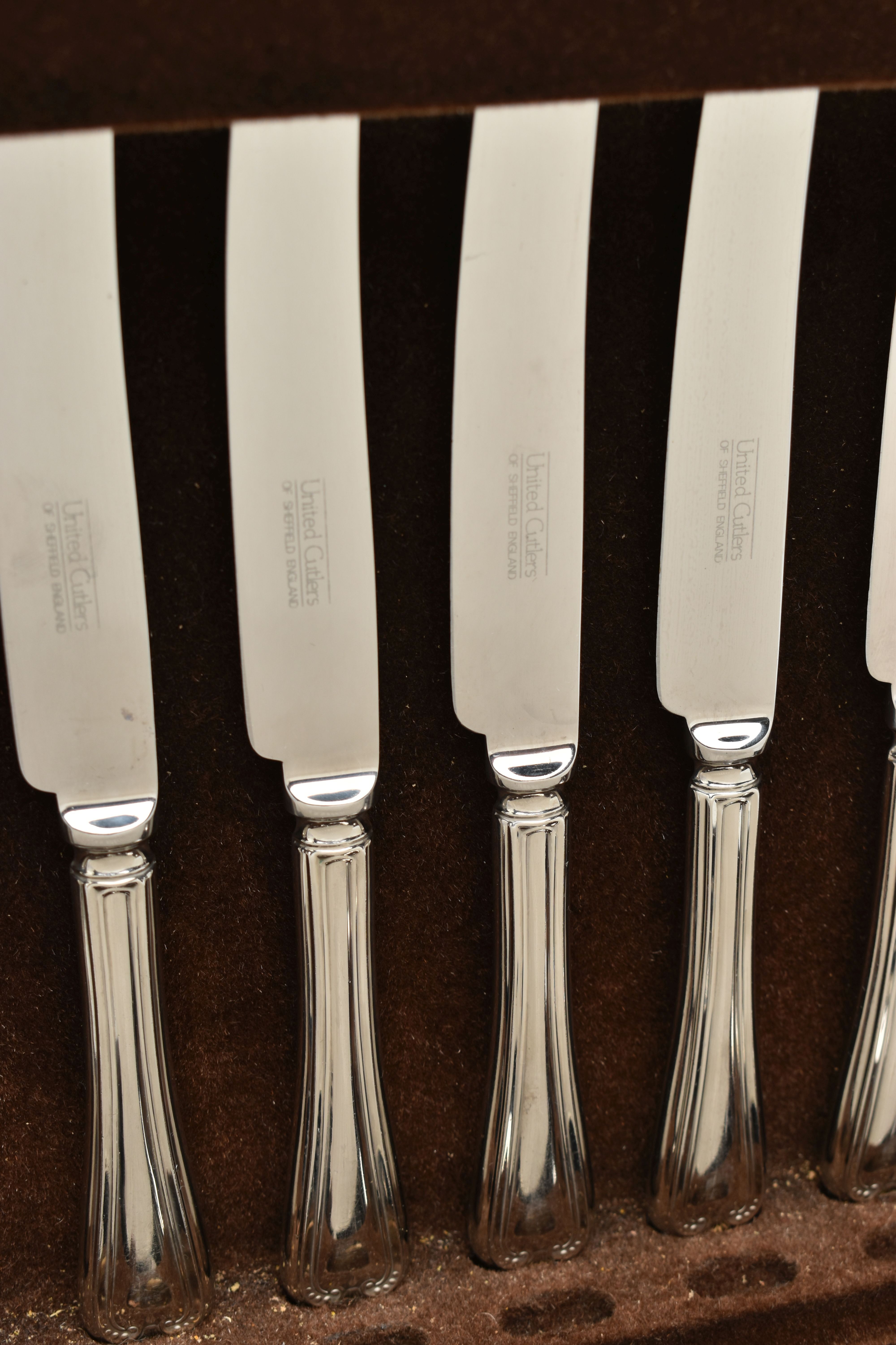 A UNITED CUTLERS OF SHEFFIELD CANTEEN, an incomplete kings pattern cutlery set, encased in a dark - Image 2 of 3