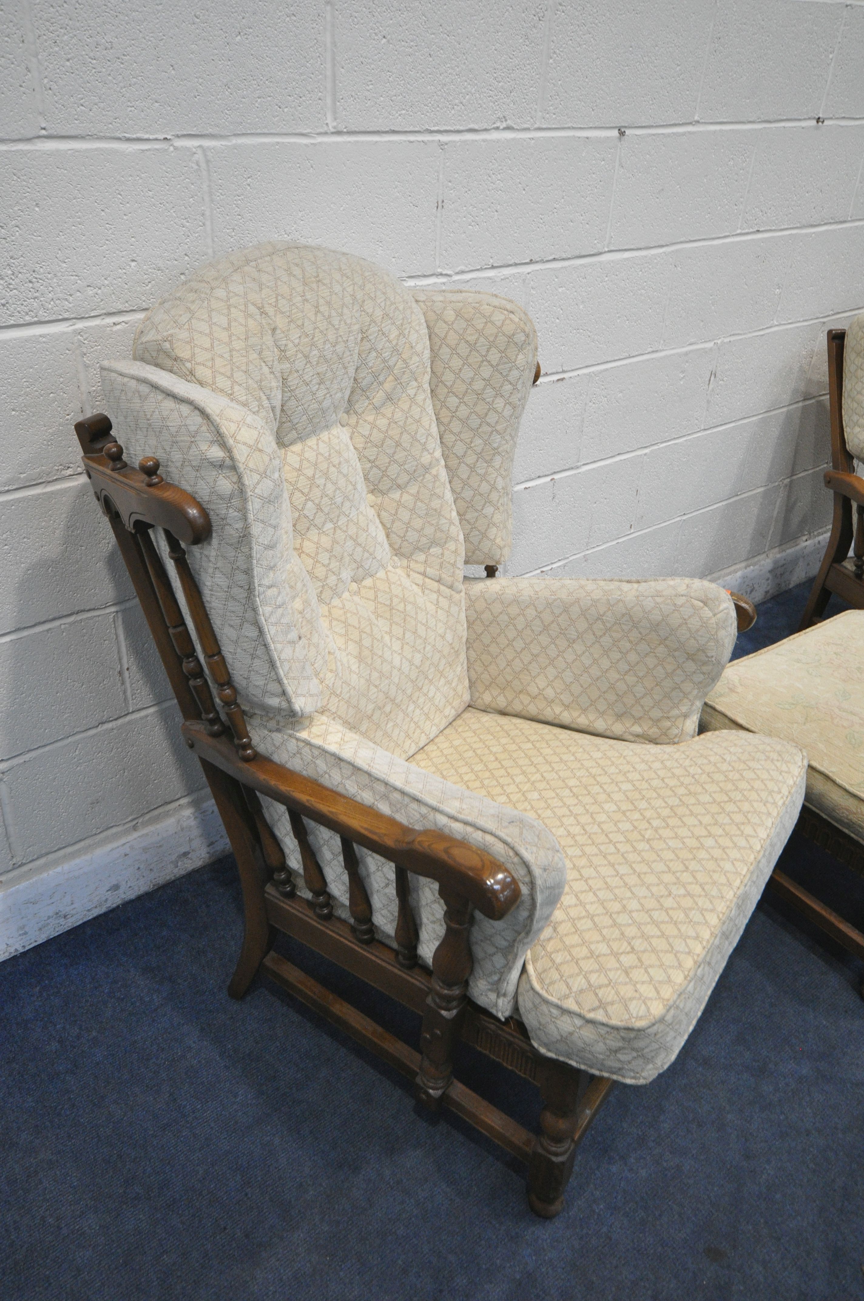 AN ERCOL 'CLOISTER' ELM AND BEECH THREE PIECE SUITE, comprising a ladies and gents armchair, along - Image 2 of 4