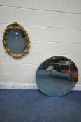 A GILT RESIN WALL MIRROR, with foliate frame, 45cm x 62cm, along with a circular bevelled edge