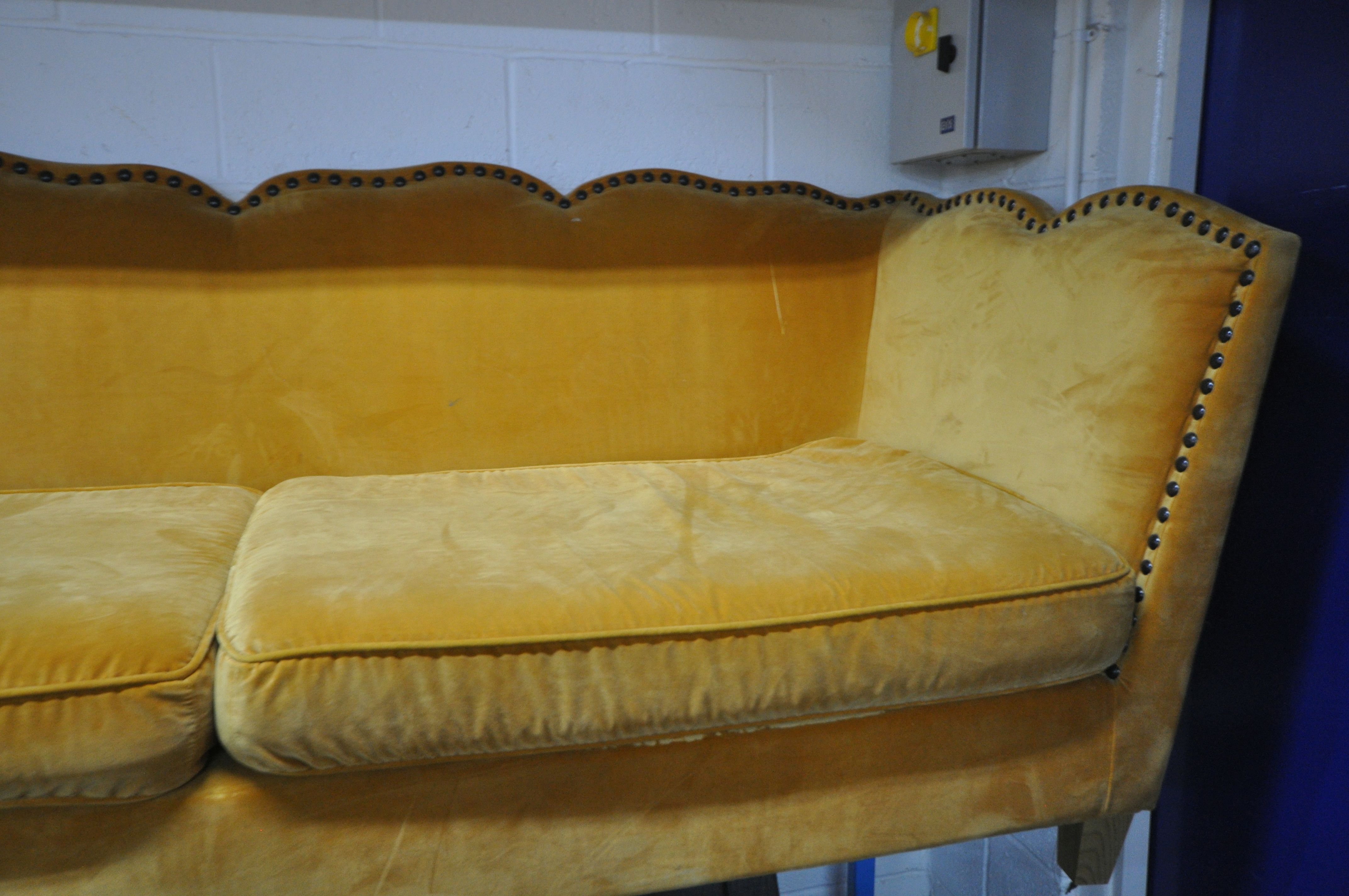 A GOLD VELOUR UPHOLSTERED SOFA, with a studded back, sides, and a shaped top, on square light oak - Image 6 of 8