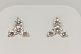 A PAIR OF 18CT GOLD DIAMOND EARRINGS, designed as a trefoil cluster of four round brilliant cut