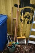 A SELECTION OF GARDEN HAND TOOLS, to include spades, brushes, push aerator, and a bucket of tools (