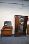 AN EDWARDIAN MAHOGANY AND INLAID WARDROBE, with a single mirrored door, on a base with a single