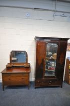AN EDWARDIAN MAHOGANY AND INLAID WARDROBE, with a single mirrored door, on a base with a single