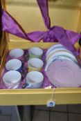 A SEALED BOXED CAROLYN QUARTERMAINE COFFEE SET, comprising six coffee cans and six saucers in