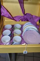 A SEALED BOXED CAROLYN QUARTERMAINE COFFEE SET, comprising six coffee cans and six saucers in